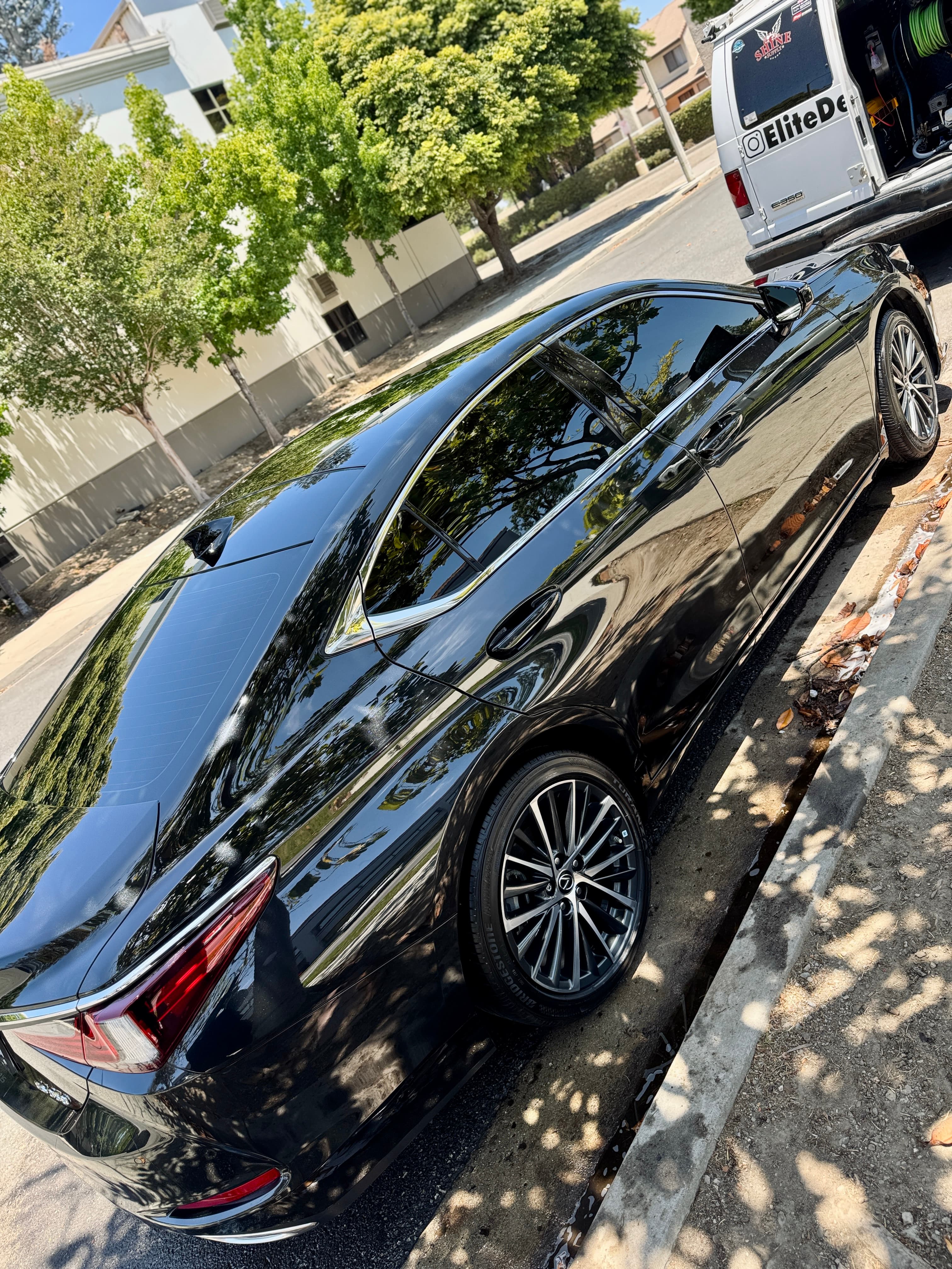 Black Lexus sedan ceramic coating – mirror finish