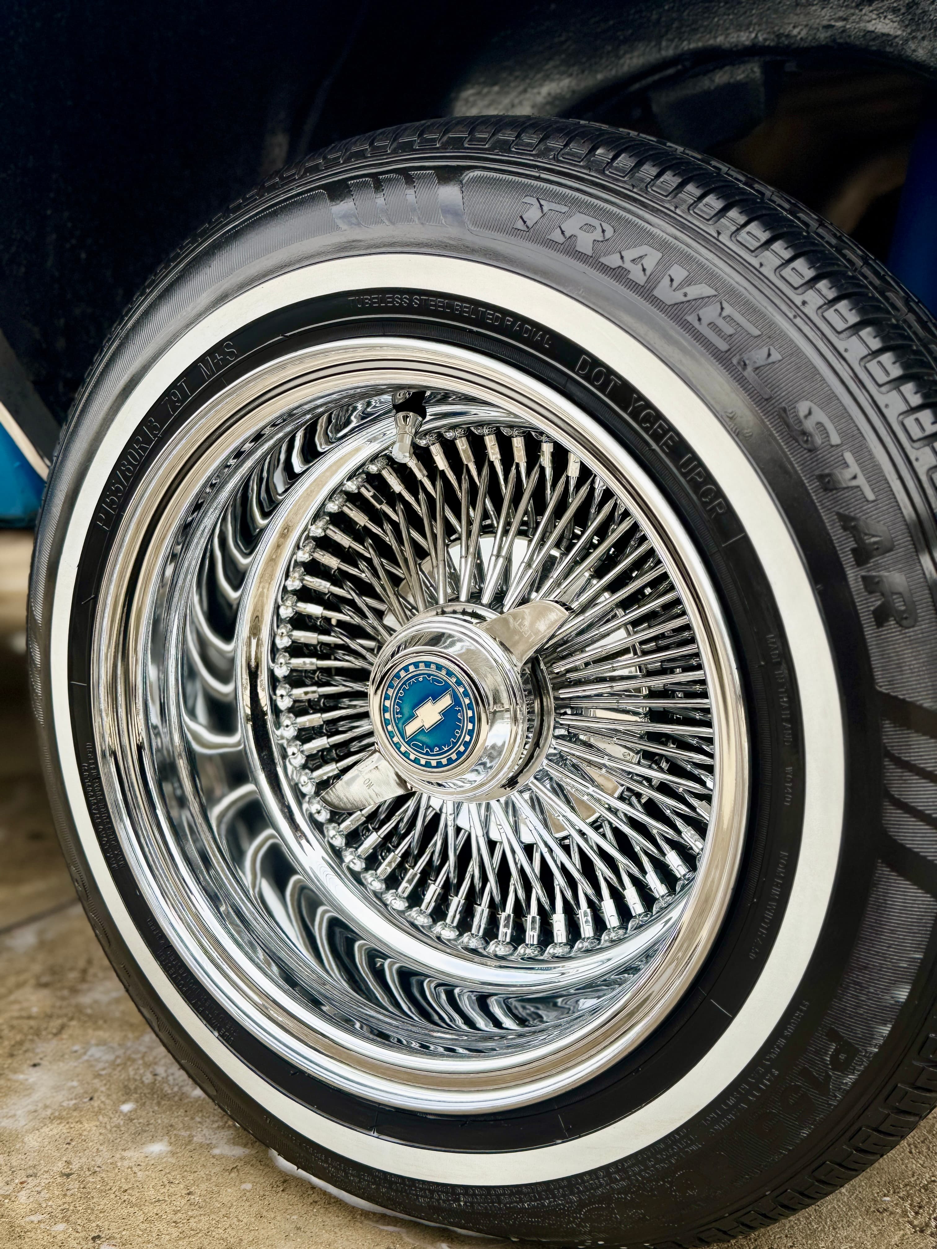Chrome wire spoke wheel with whitewall tire